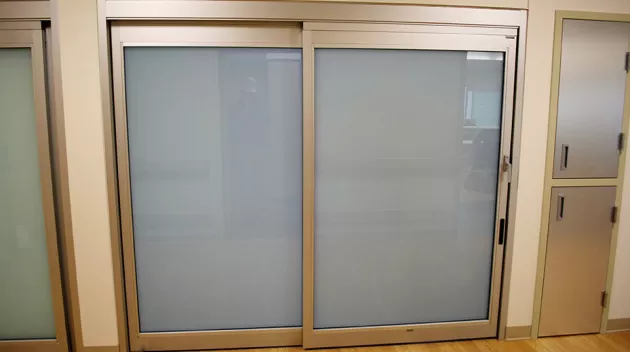 A set of doors in a hospital room.