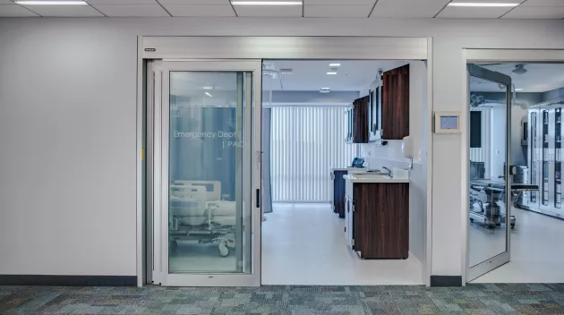 A set of sliding doors in a hospital room.