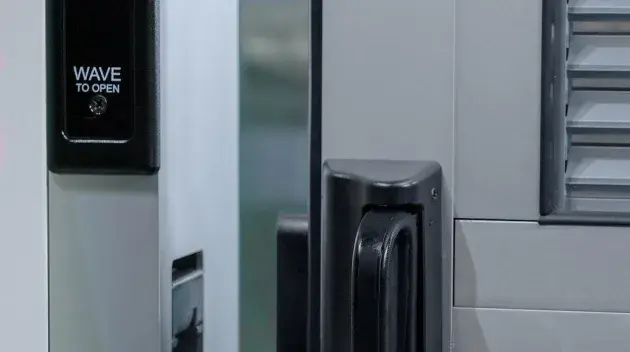 A view of a door opening sensor and the door latch.