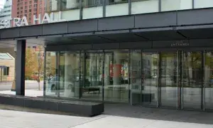 Building with manual swing pivot doors.