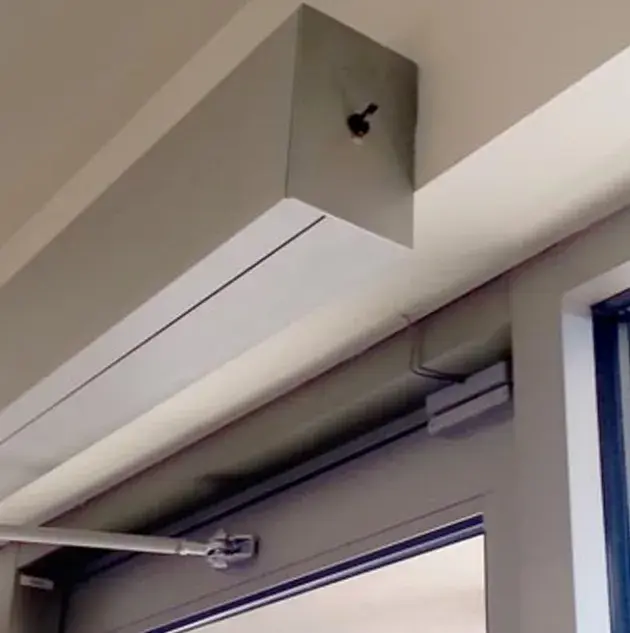 A door with a swinging door opener at the top.