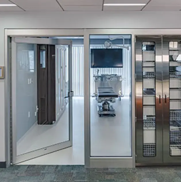 A Manual swinging door in a hospital setting.