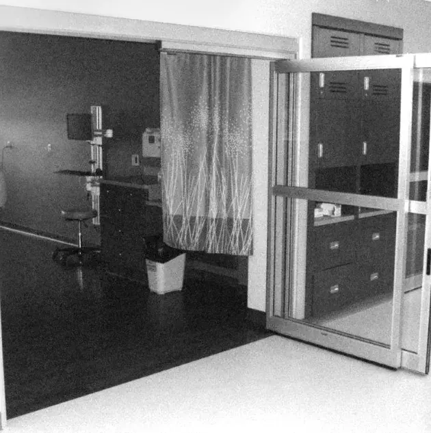 An open set of doors to a hospital room.