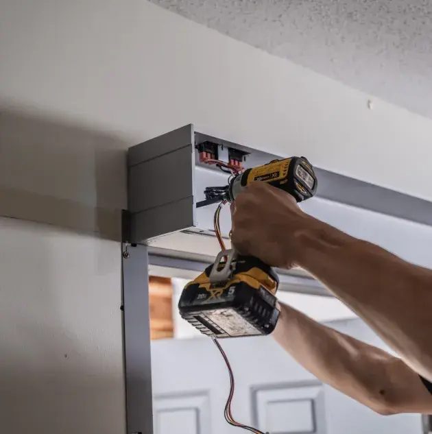 A person installing a set of doors.