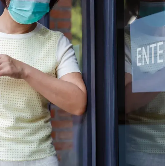A person using a touchless door.