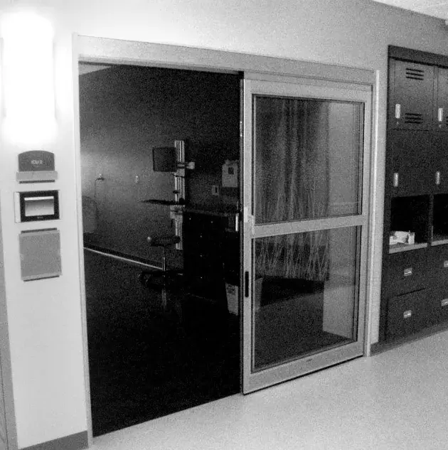 An open set of doors to a hospital room.