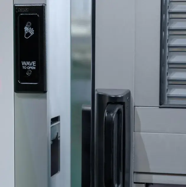 A view of a door opening sensor and the door latch.