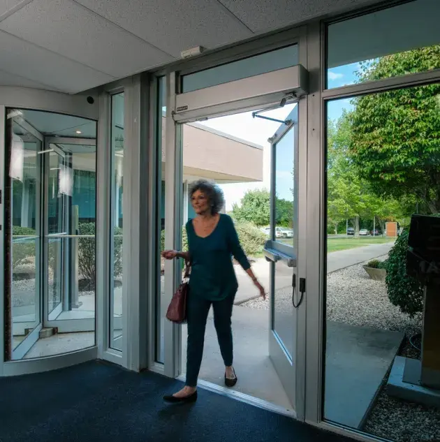 M-Force Swing Door Opener - Woman Walking Through Door