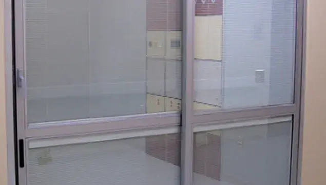 A set of doors in a hospital room.