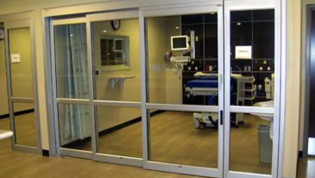 A set of doors in a hospital room.