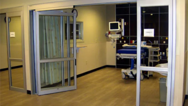 A set of doors in a hospital room.