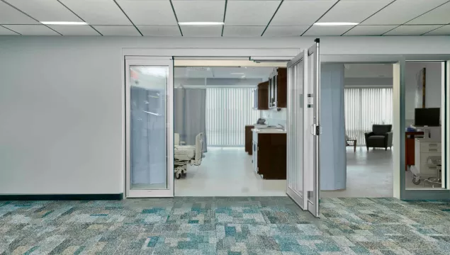 A set of hospital doors with one door open.