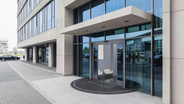 A set of open doors to a commercial store.