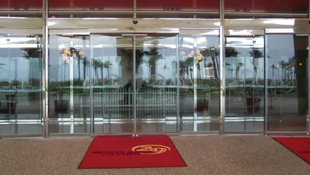 a set of all glass doors at a casino.