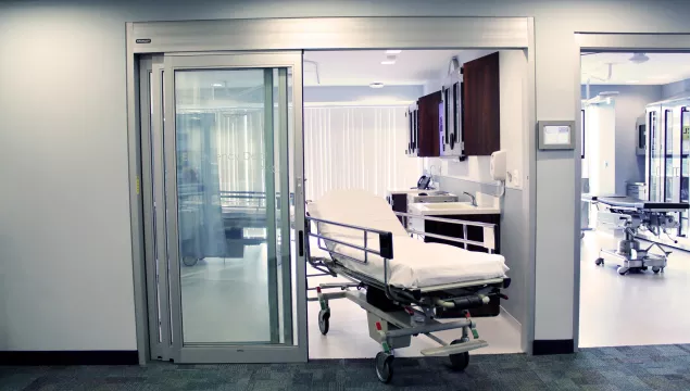 A set of doors in a hospital room.