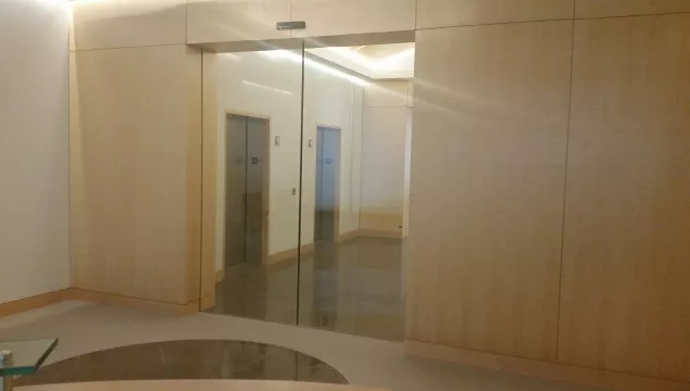 A set of glass doors in an office.