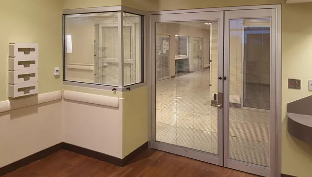 A set of doors in a hospital room.