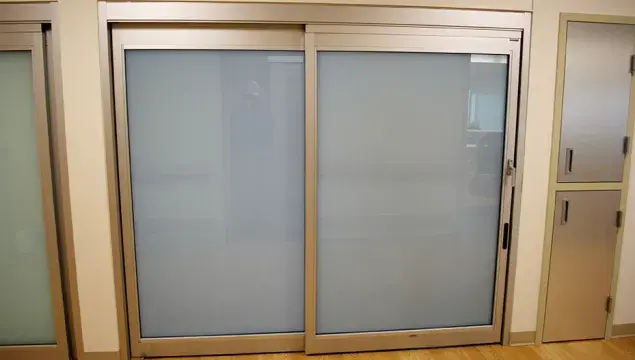 A set of doors in a hospital room.
