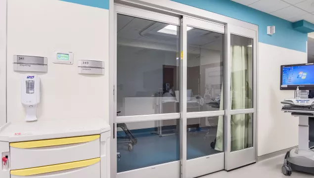 A set of sliding doors in a hospital room.