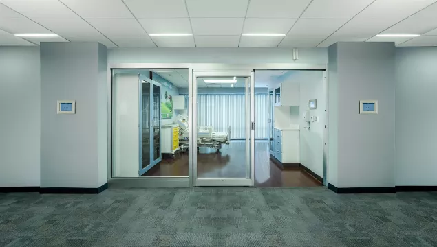 A set of sliding doors in a hospital room.